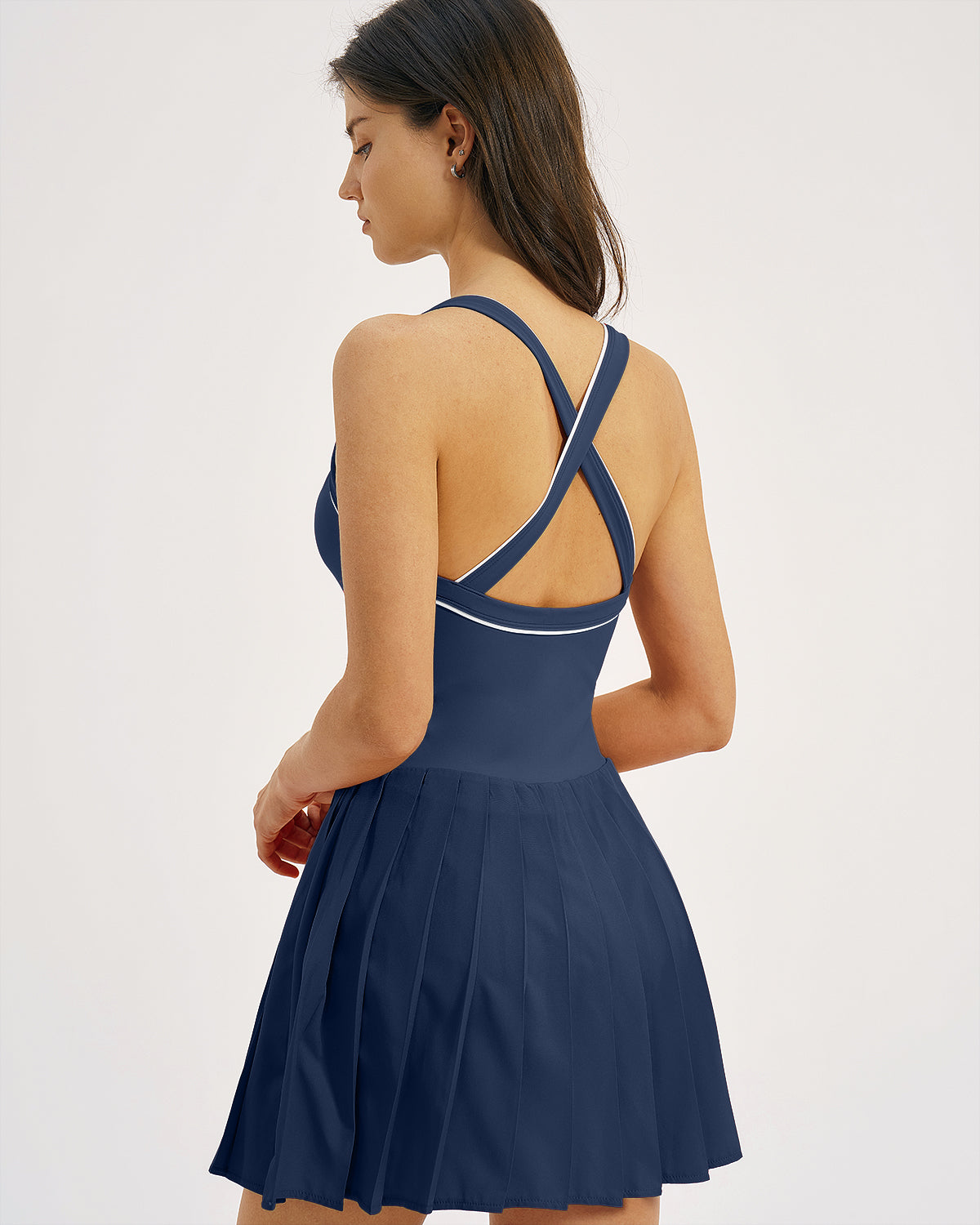 QINSEN Womens V Neck Pleated Tennis Dresses Built in Shorts Cross Back Sleeveless Athletic Dress with Pockets